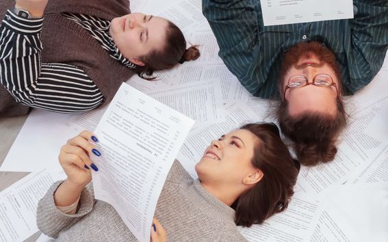 Board members holding papers 