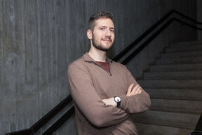 Marcell Berta leaning to a wall