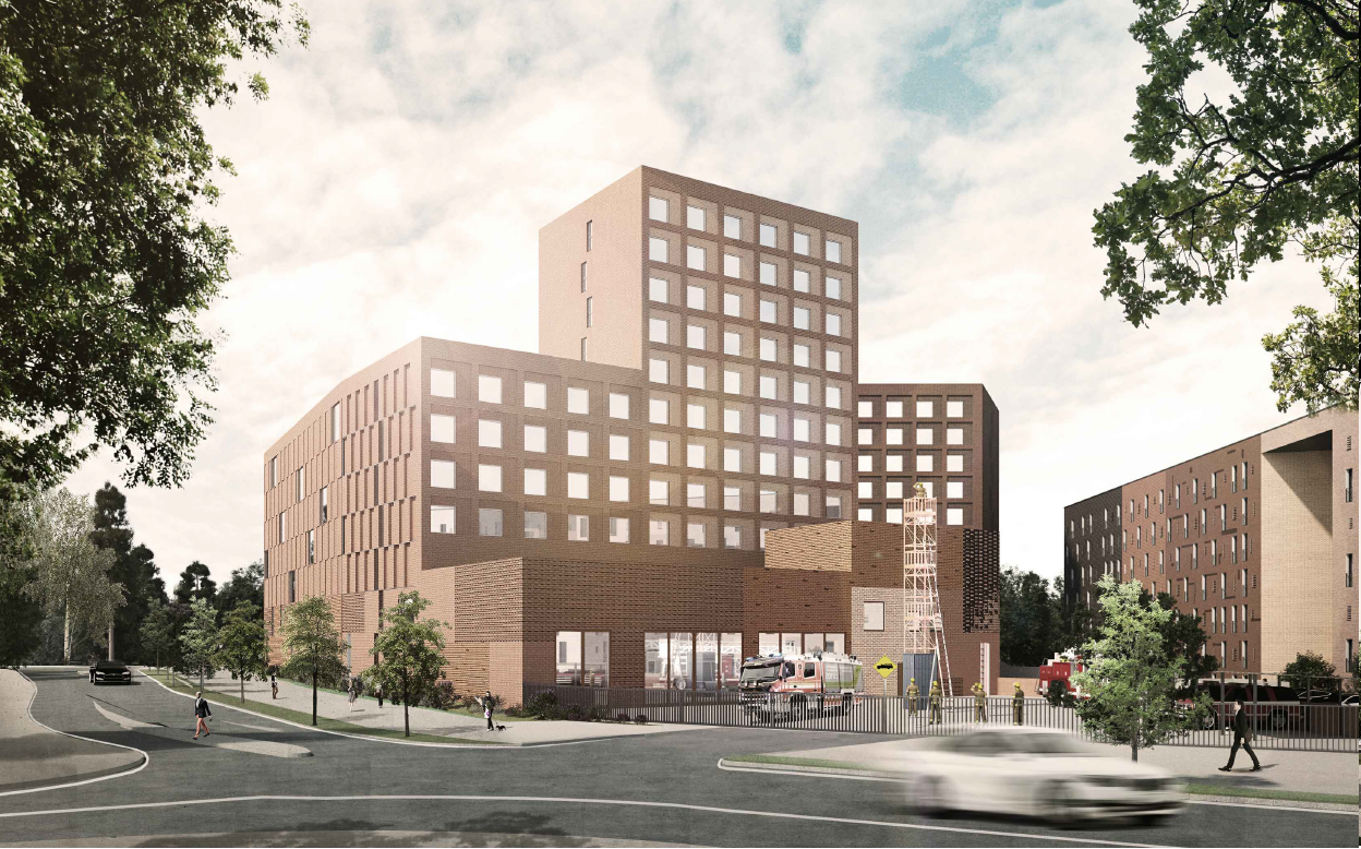 Asuinkerrostalo, jonka alakerroksissa sijaitsee paloasema