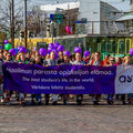 Students walking with a banner "The best students life in the world"