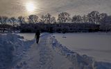 Person walking in the snow in Otaniemi.