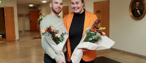 Sakari Ropponen and Fanni Mattsson looking happy and holding flower bouquets