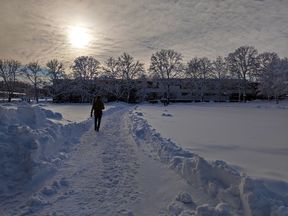 Person walking in the snow in Otaniemi.